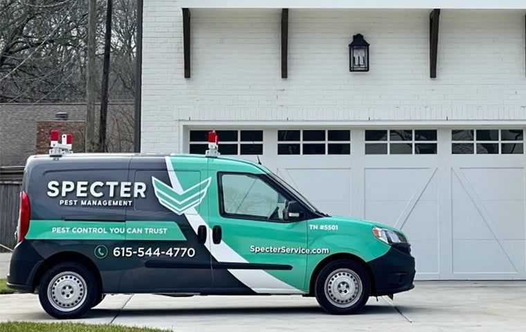 a company van in front of a nice home